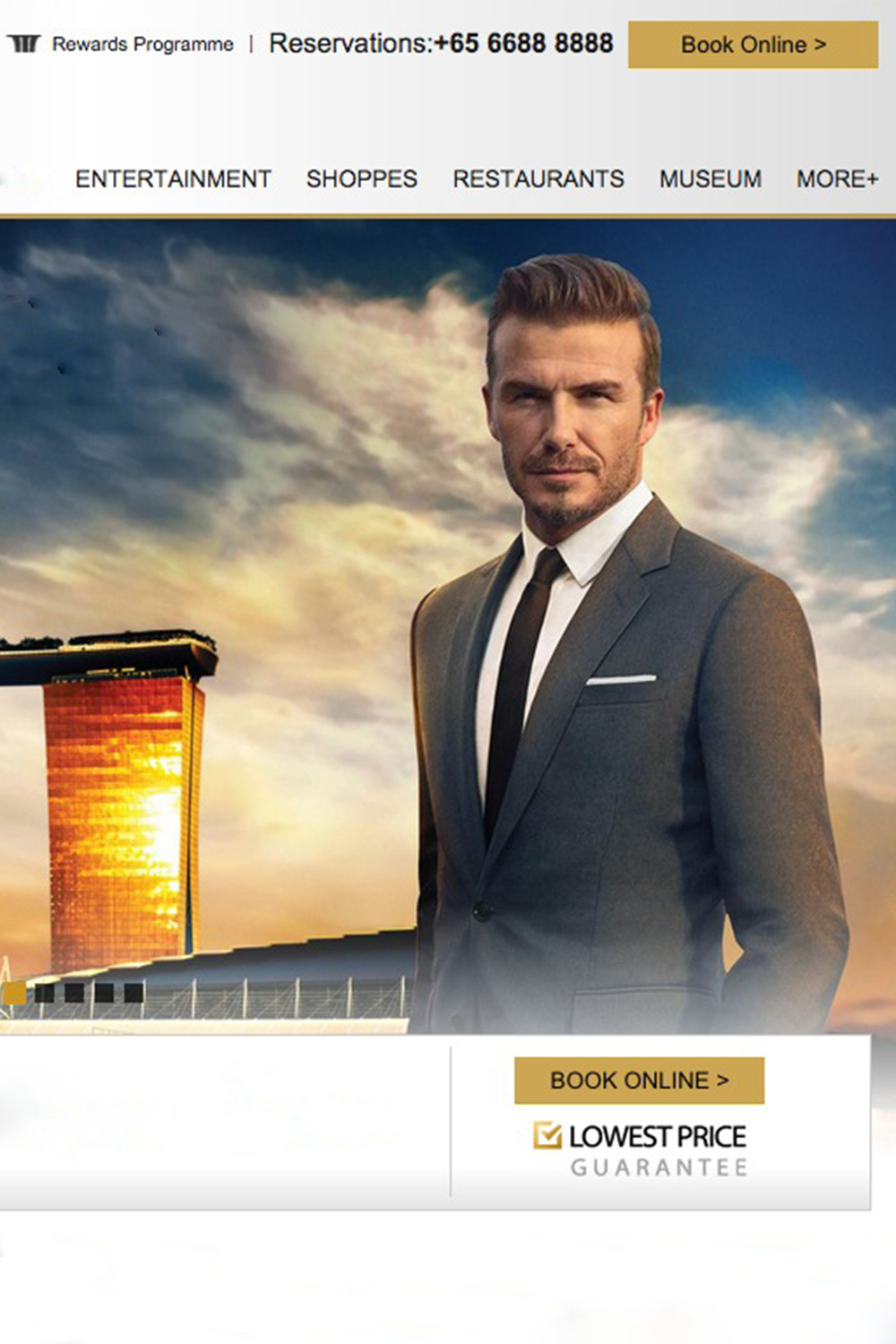 David Beckham in a suit standing in front of a luxury resort