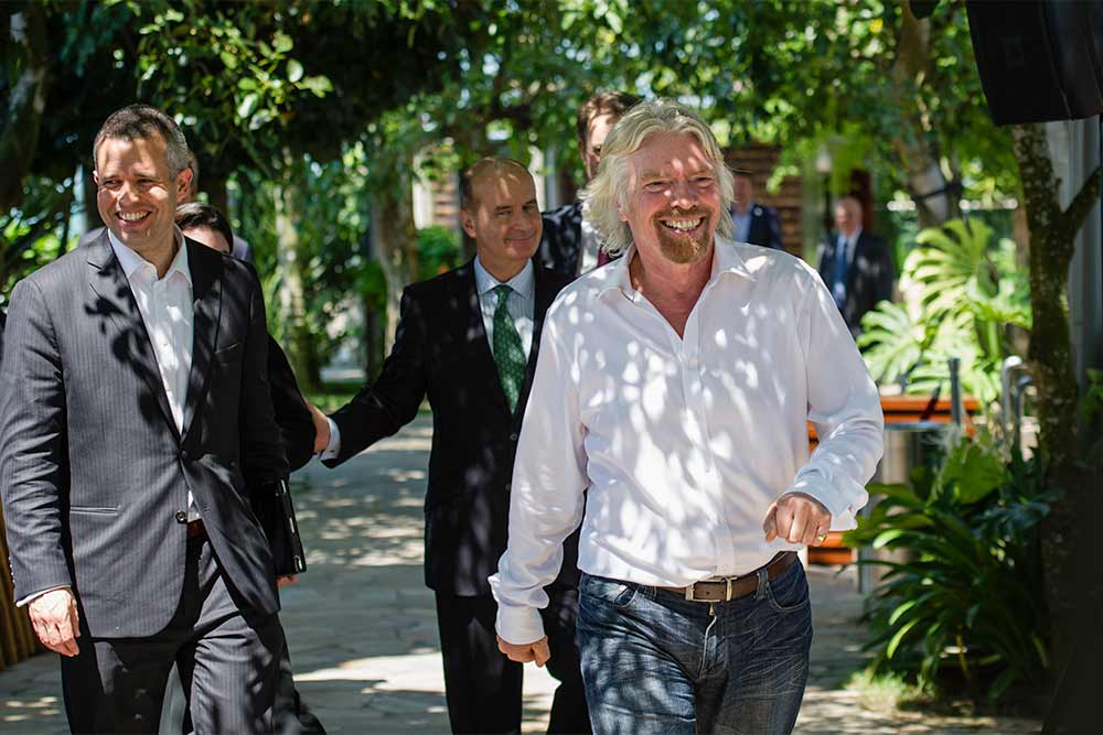 A smiling Sir Richard Branson, Jose Figueres and Peter Boyd