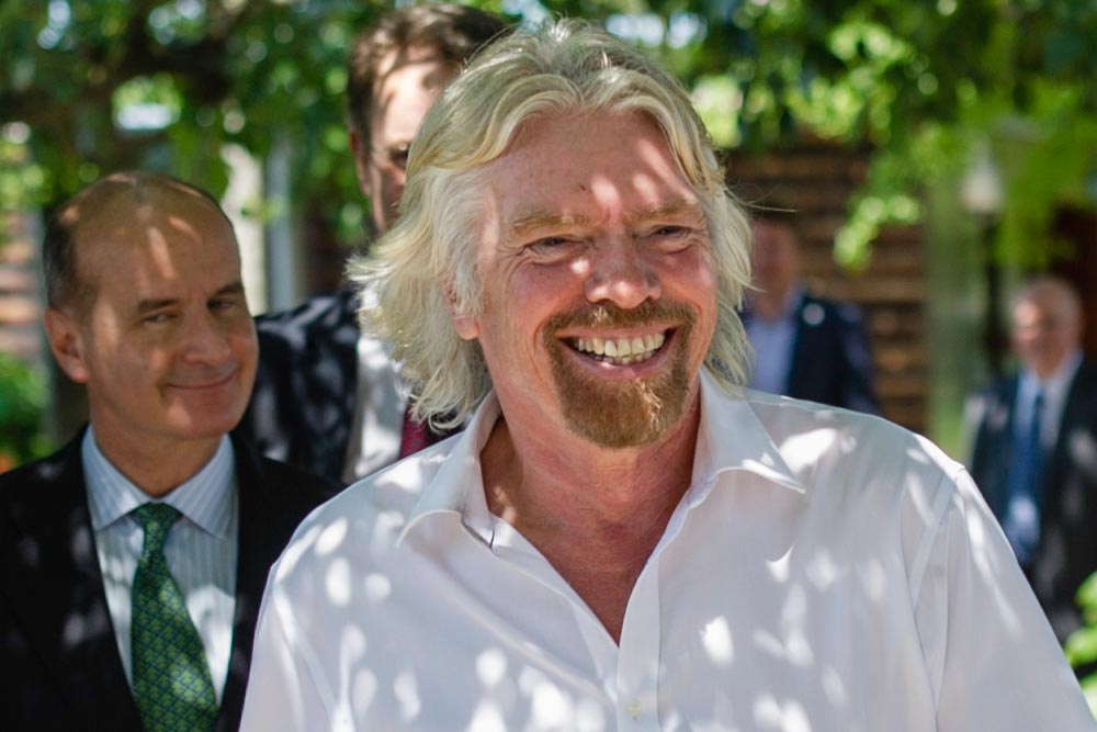 Richard Branson smiling with Jose Figueres