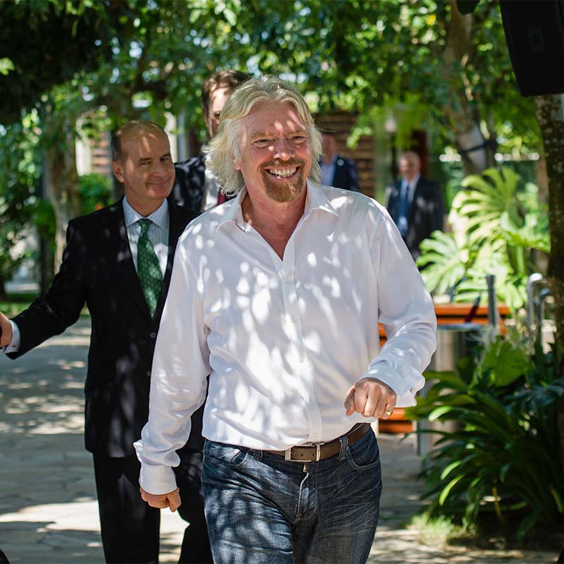 Richard Branson smiling with Jose Figueres